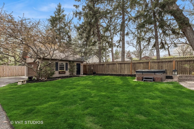 view of yard with a hot tub