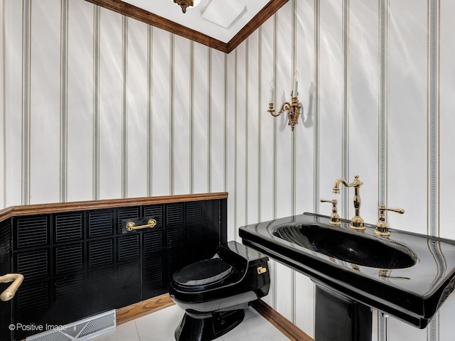 half bath featuring toilet