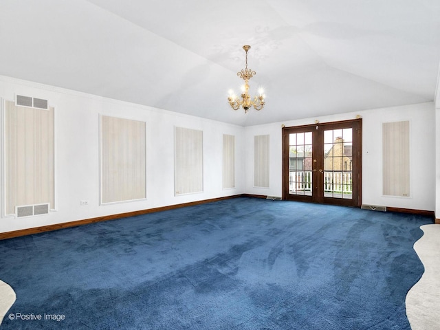 empty room with a notable chandelier, visible vents, french doors, and dark carpet