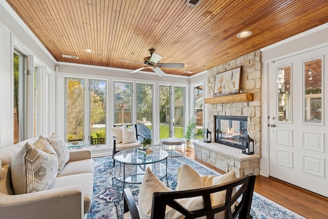 sunroom with recessed lighting, wooden ceiling, ornamental molding, and wood finished floors