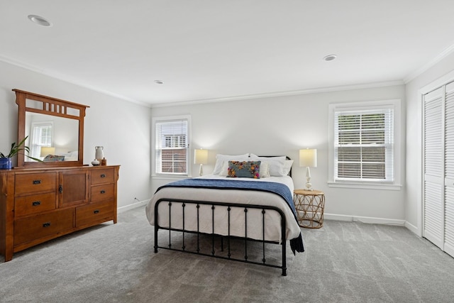 bedroom with ornamental molding, carpet, and multiple windows