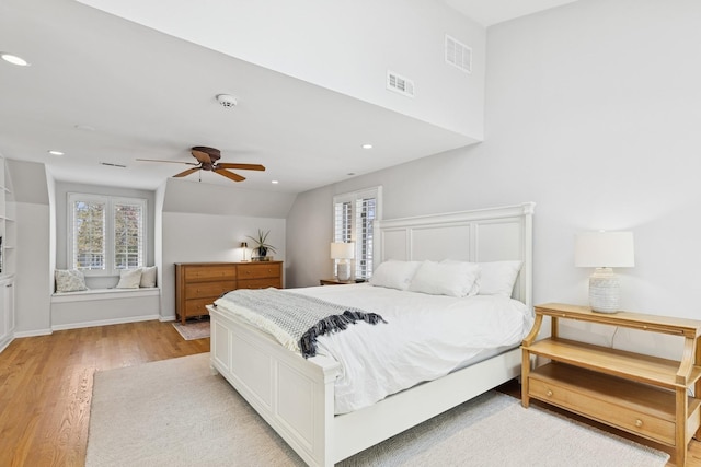 bedroom with recessed lighting, ceiling fan, visible vents, and light wood finished floors