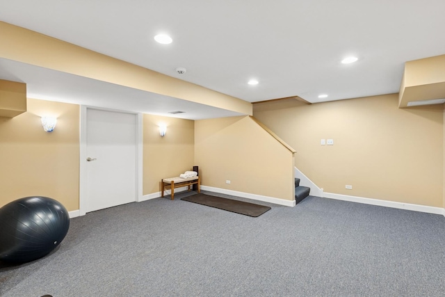 finished basement with carpet floors, recessed lighting, baseboards, and stairway