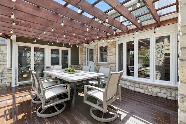 wooden terrace featuring a pergola and outdoor dining space
