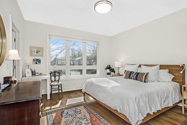 1122 Pitner Ave, Evanston, IL 60202 - bedroom with dark wood-type flooring and baseboards