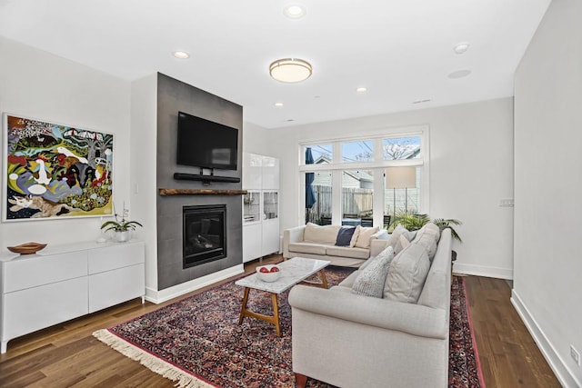 1122 Pitner Ave, Evanston, IL 60202 - living area with a glass covered fireplace, wood finished floors, and recessed lighting