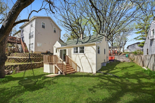 15 N Hillcrest Ave, Fox Lake, IL 60020 - rear view of house featuring stairway, a lawn, fence, and a wooden deck