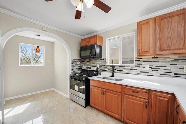 15 N Hillcrest Ave, Fox Lake, IL 60020 - kitchen featuring backsplash, black microwave, a sink, and gas range