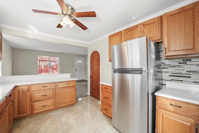 15 N Hillcrest Ave, Fox Lake, IL 60020 - kitchen featuring ceiling fan, light countertops, freestanding refrigerator, tasteful backsplash, and ornamental molding