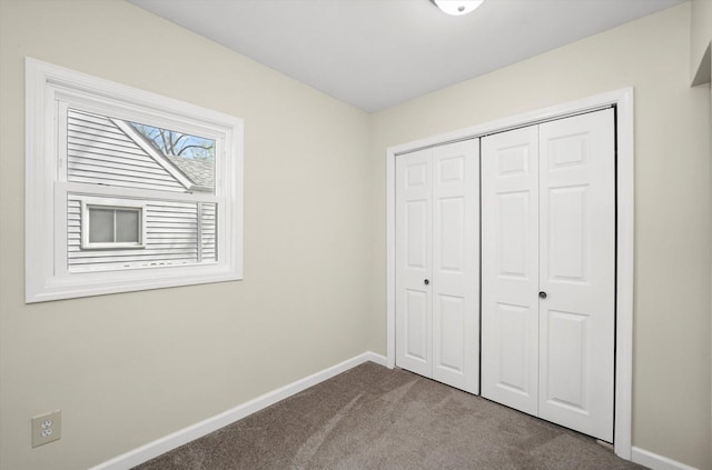 15 N Hillcrest Ave, Fox Lake, IL 60020 - unfurnished bedroom featuring a closet, baseboards, and carpet flooring