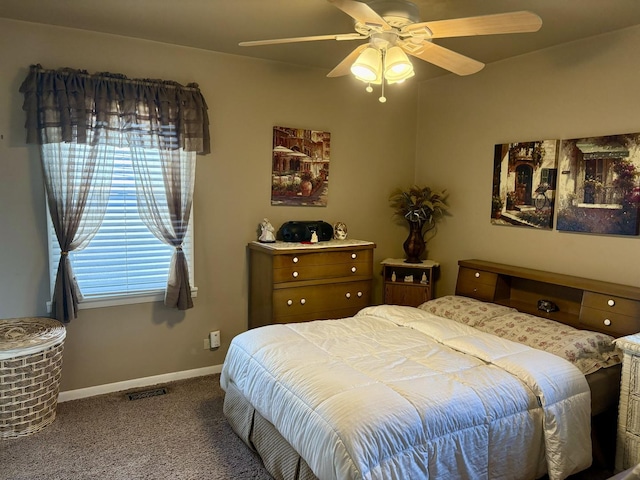 bedroom featuring baseboards, carpet, ceiling fan, and visible vents