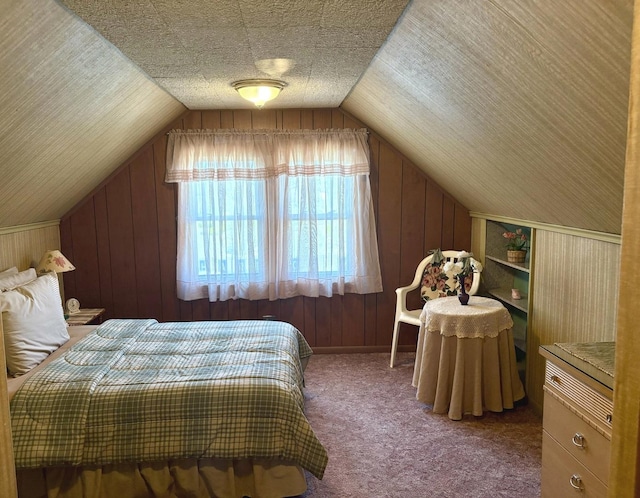 carpeted bedroom with wooden walls and lofted ceiling