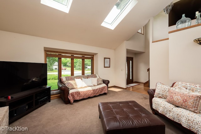 2803 Monterra Dr, Spring Grove, IL 60081 - carpeted living area featuring a skylight, high vaulted ceiling, and baseboards