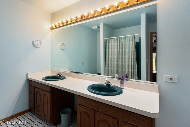 2803 Monterra Dr, Spring Grove, IL 60081 - bathroom featuring double vanity, a shower with shower curtain, and baseboards