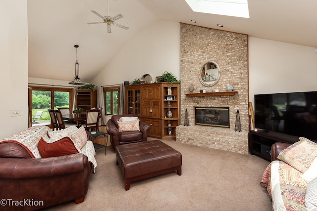 2803 Monterra Dr, Spring Grove, IL 60081 - living area with high vaulted ceiling, ceiling fan, carpet, a brick fireplace, and a skylight