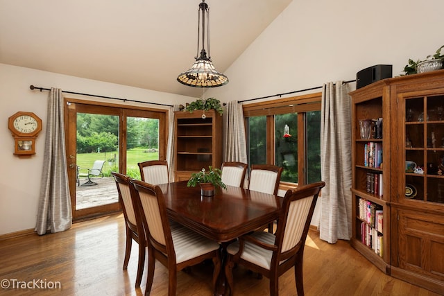 2803 Monterra Dr, Spring Grove, IL 60081 - dining room featuring light wood-style flooring, high vaulted ceiling, and baseboards