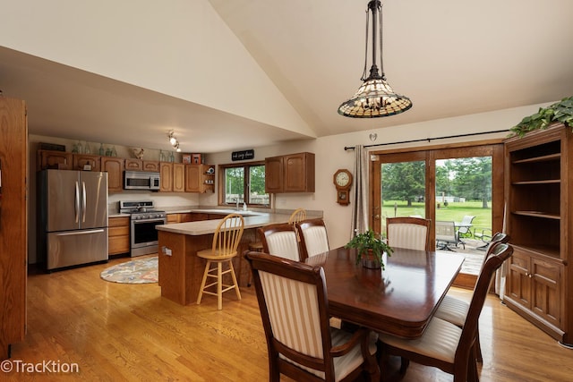 2803 Monterra Dr, Spring Grove, IL 60081 - dining area featuring light wood finished floors and high vaulted ceiling