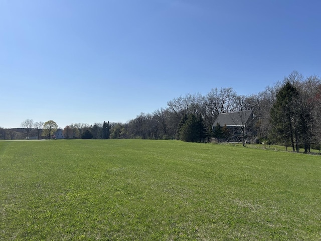 view of yard with a rural view