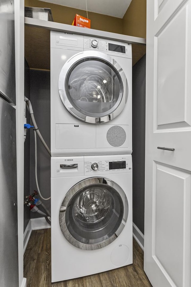 221 N Kenilworth Ave Unit 310, Oak Park, IL 60302 - laundry room featuring stacked washer and clothes dryer, wood finished floors, and baseboards