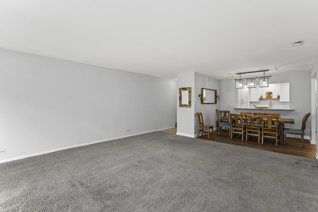 221 N Kenilworth Ave Unit 310, Oak Park, IL 60302 - carpeted living area featuring baseboards and a sink