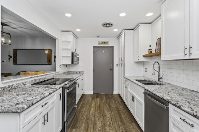 221 N Kenilworth Ave Unit 310, Oak Park, IL 60302 - kitchen with open shelves, appliances with stainless steel finishes, a sink, white cabinets, and recessed lighting
