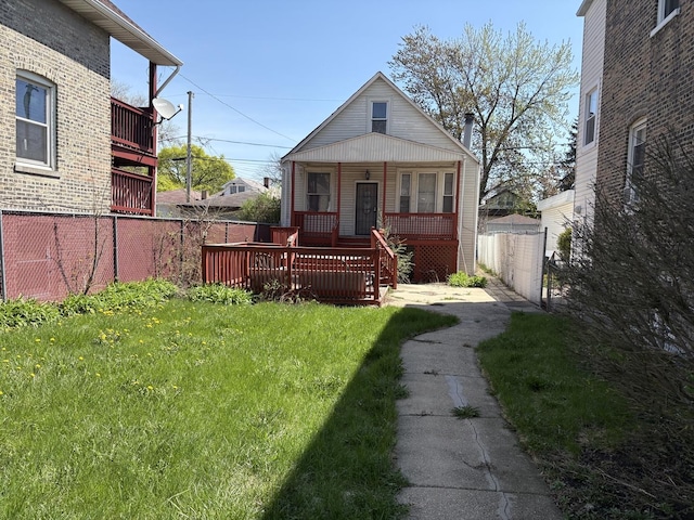 1649 N Latrobe Ave, Chicago, IL 60639 - back of house featuring brick siding, a lawn, fence, and covered porch