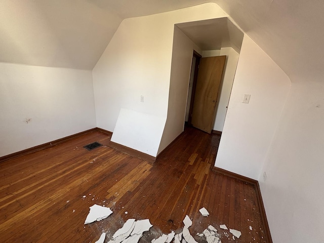 1649 N Latrobe Ave, Chicago, IL 60639 - bonus room featuring baseboards, vaulted ceiling, hardwood / wood-style flooring, and visible vents