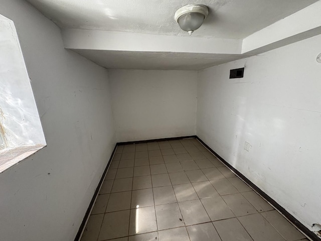 1649 N Latrobe Ave, Chicago, IL 60639 - tiled empty room with baseboards