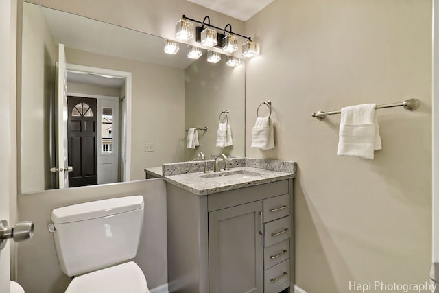 bathroom with toilet and vanity