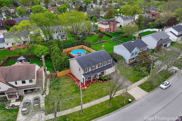 aerial perspective of suburban area with a pool