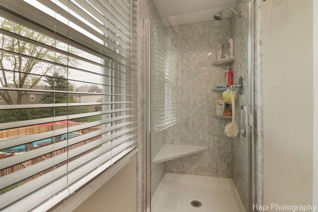 bathroom featuring a shower stall