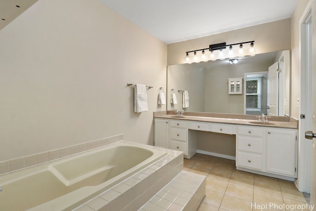 bathroom with tile patterned floors, double vanity, and a garden tub