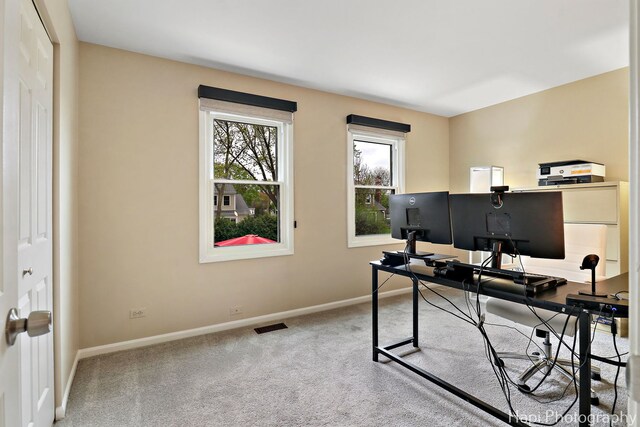 home office featuring baseboards and carpet