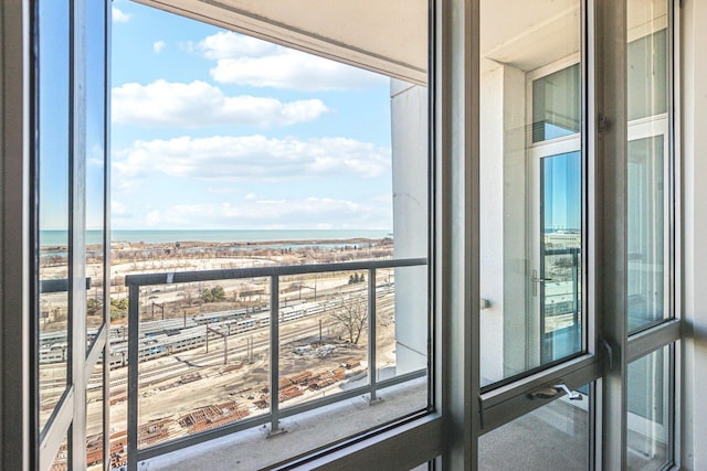 balcony featuring a water view