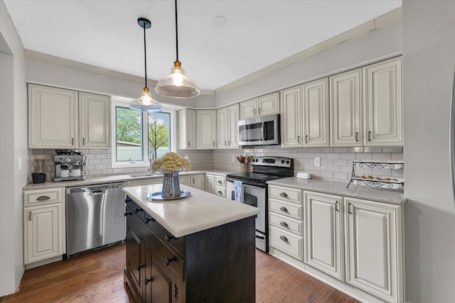 kitchen with light countertops, stainless steel appliances, crown molding, and decorative backsplash