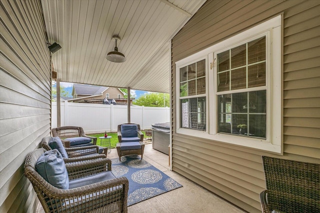 view of patio featuring fence and an outdoor living space