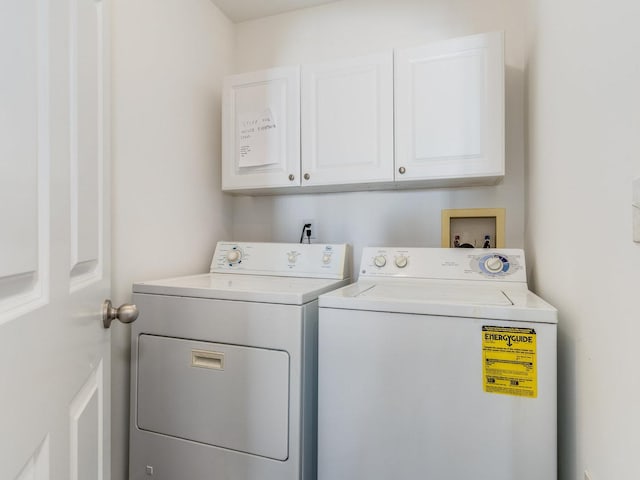 laundry room with washer and dryer and cabinet space