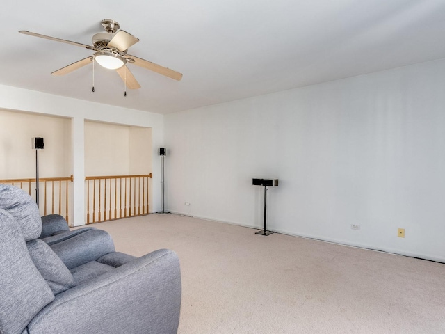 carpeted living room with ceiling fan