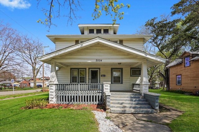 view of front facade with a porch and a front lawn