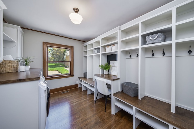 mudroom featuring dark wood-type flooring, baseboards, and crown molding