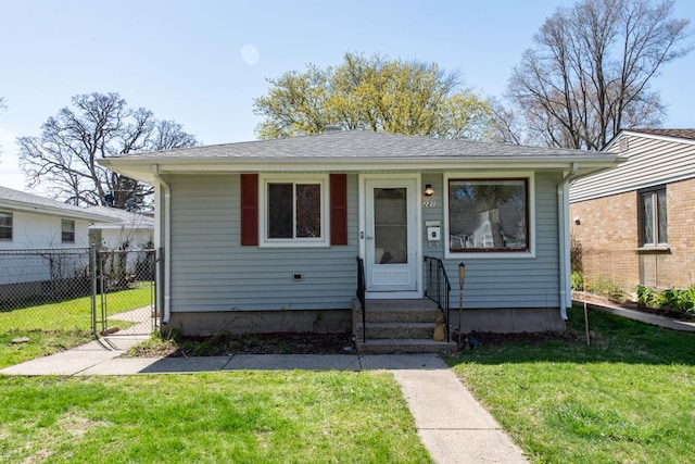 2214 Gilead Ave, Zion, IL 60099 - bungalow-style house with fence, a gate, and a front yard