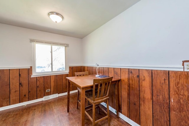 2214 Gilead Ave, Zion, IL 60099 - dining space featuring visible vents, wainscoting, wood finished floors, and wood walls
