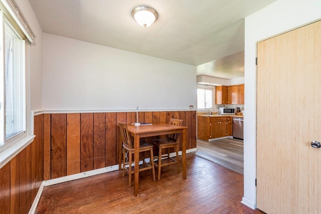2214 Gilead Ave, Zion, IL 60099 - dining room with wooden walls, a wainscoted wall, and dark wood finished floors