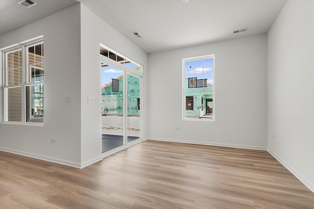 4 Harborside Way, Hawthorn Woods, IL 60047 - spare room featuring visible vents, plenty of natural light, light wood finished floors, and baseboards