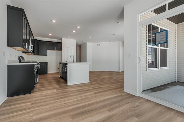 4 Harborside Way, Hawthorn Woods, IL 60047 - kitchen with light wood-style flooring, baseboards, open floor plan, electric stove, and dark cabinetry