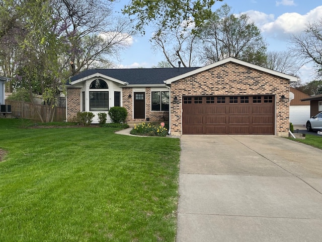ranch-style home featuring a front lawn, concrete driveway, brick siding, and a garage