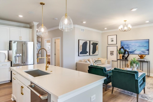 3 Harborside Way, Hawthorn Woods, IL 60047 - kitchen with light wood finished floors, a sink, stainless steel appliances, visible vents, and ornamental molding