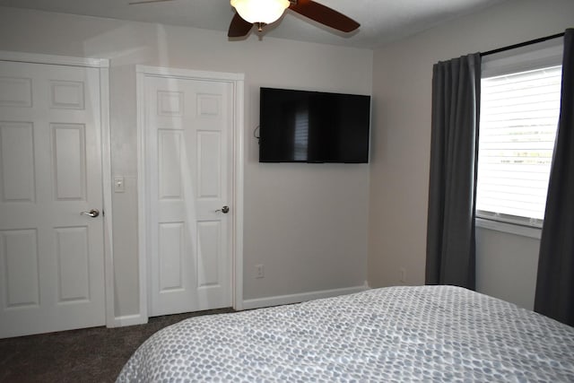 carpeted bedroom with a ceiling fan