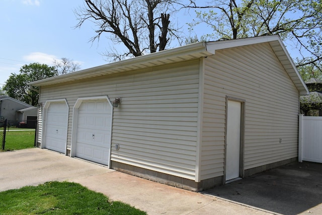 detached garage with fence