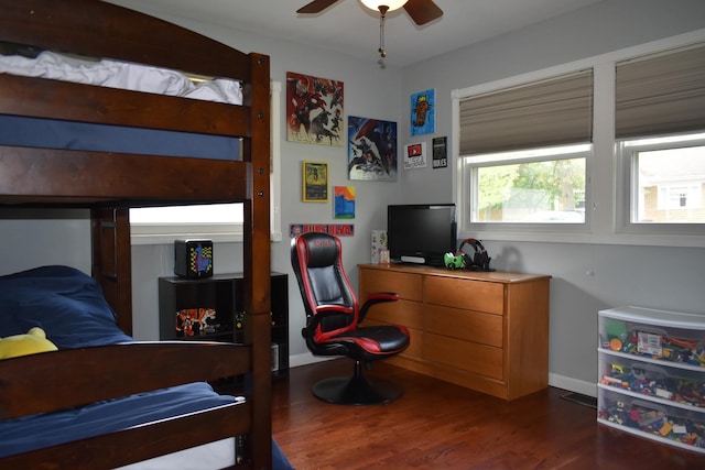 bedroom with baseboards, a ceiling fan, and wood finished floors